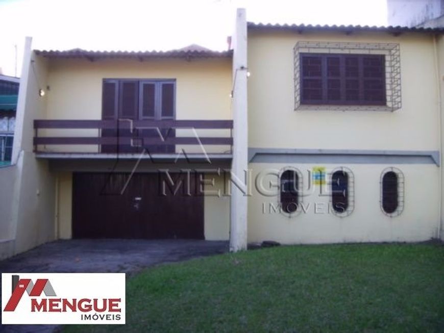 Casa residencial com 3 dormitórios e 2 vagas à venda no bairro Jardim Itú em Porto Alegre com 195,00