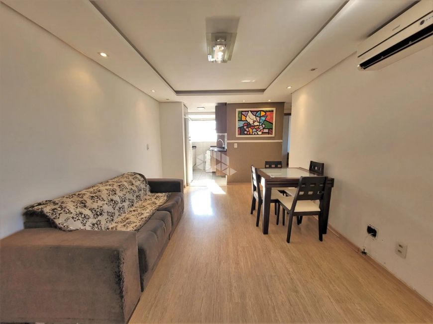 Apartamento mobiliado com 03 Dormitórios com churrasqueira na sacada e vaga escriturada no bairro Ig