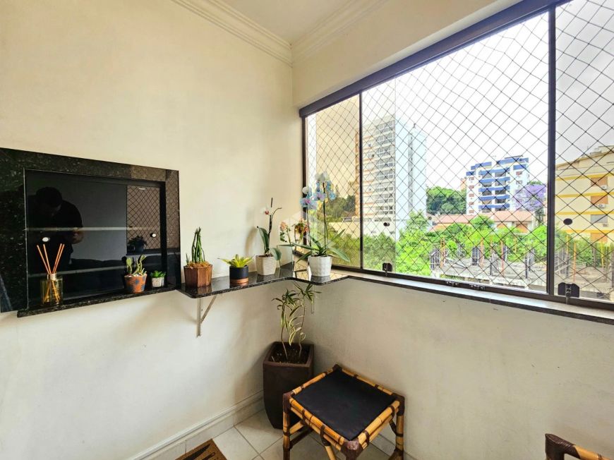 Apartamento 65m² mobiliado com 2 dormitórios, 1 vaga de Garagem, sacada com churrasqueira integrada