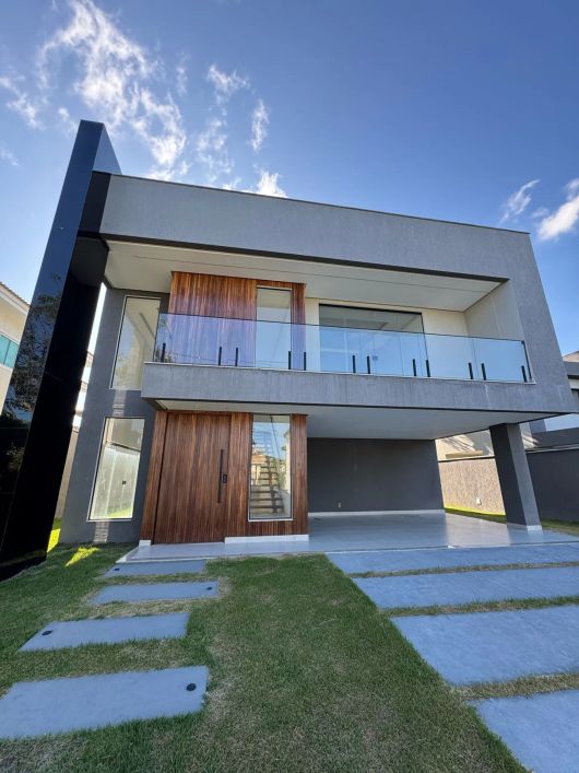 Casa a venda em alphaville litoral norte 1 com 4 suites com piscina