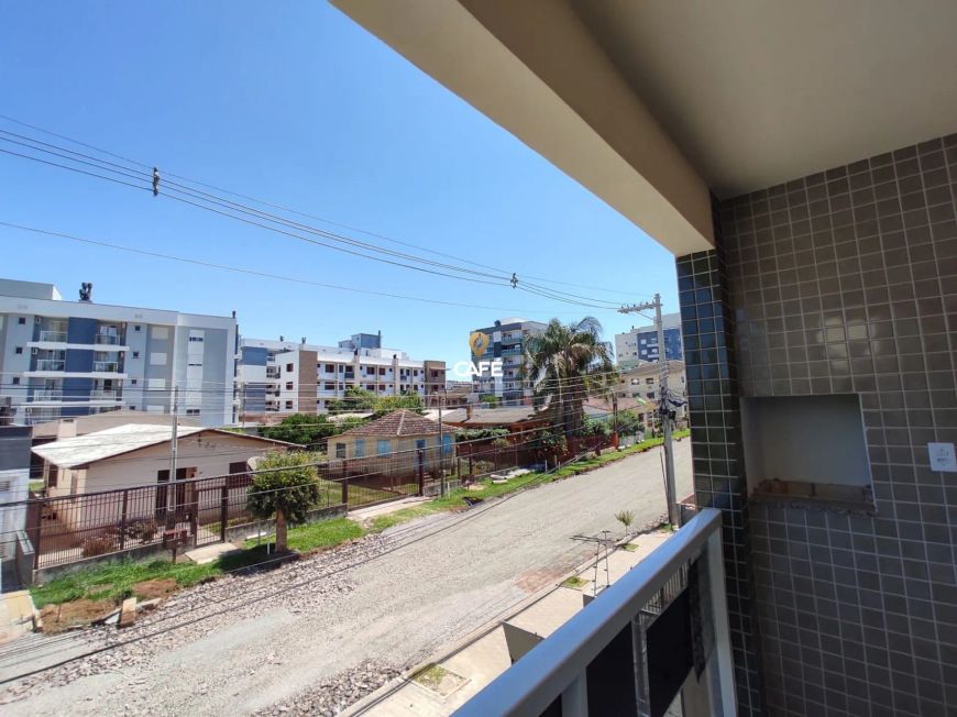 Apartamento 02 dormitórios com suíte, vaga de garagem, sacada e churrasqueira.
