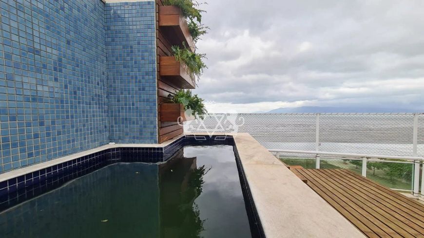 Cobertura duplex frente mar com piscina privativa e 3 vagas na garagem no bairro Aruan em Caraguata