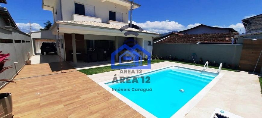 Linda casa à venda no Jardim Britânia - 4 dormitórios, sendo 2 suítes, banheiro, sala com 2 ambient